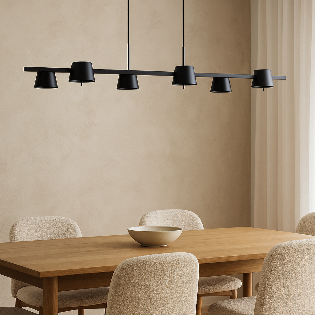 Modern black pendant light over a wooden dining table with beige chairs in a room with beige walls and a curtain.