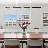black modern linear pendant light with 14 opal glass shades dimmable installed in rose bay within a luxury apartment over a solid oak dining table