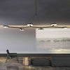 black long 1600mm 160cm linear branching chandelier circular disk lights suited over long dining table or living area