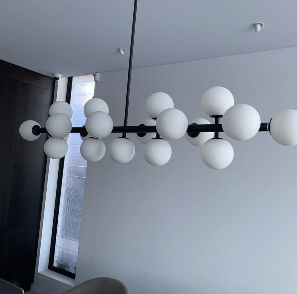 high quality pendant lights australia black 19 light dimmable modern contemporary white glass opal suspended over a wonderful dining table 