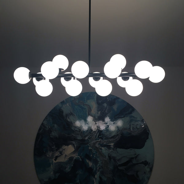 Mimosa replica black minimal dining table feature lighting artwork blues natural interior designer